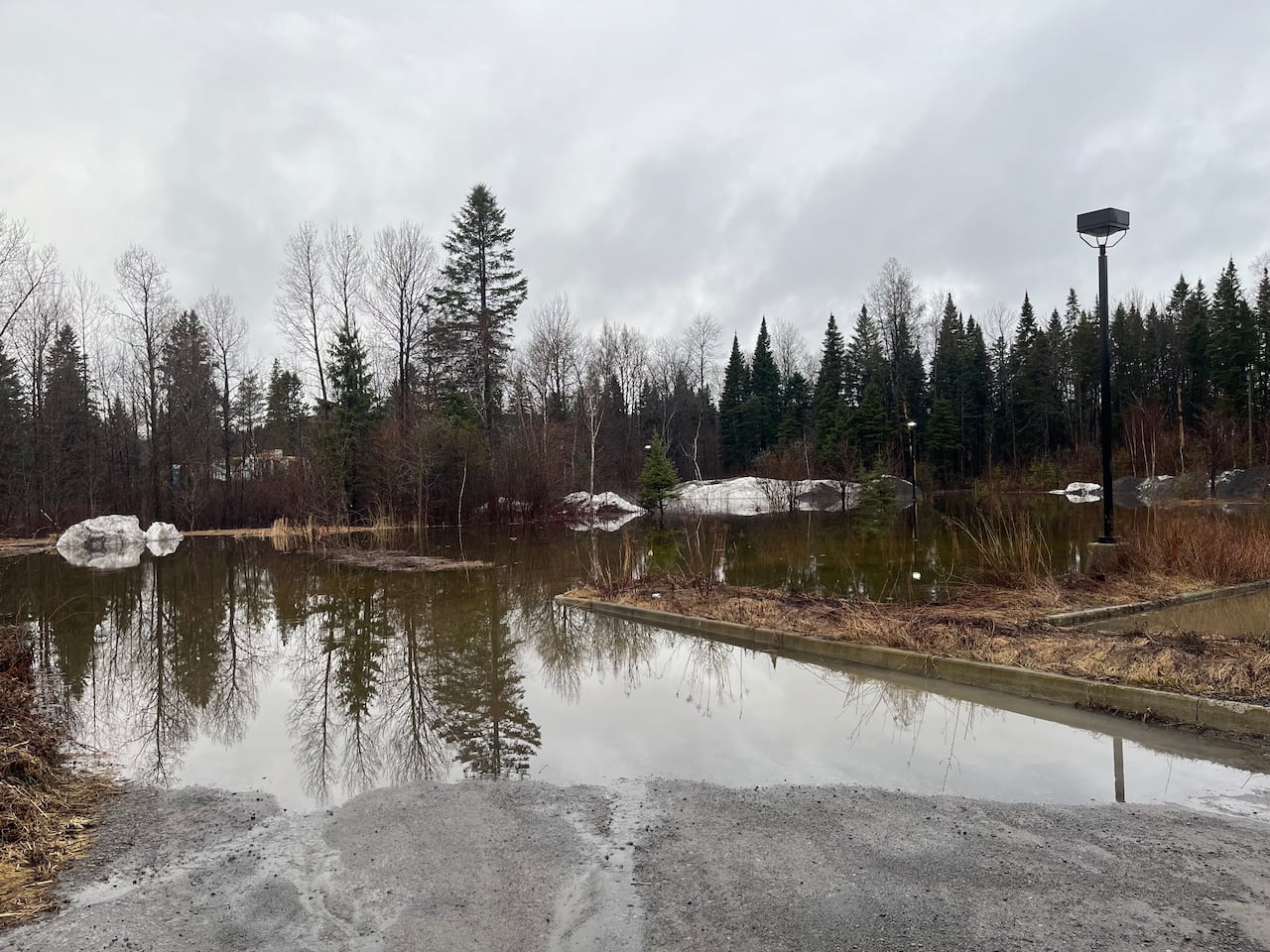 The parking lot of Archibald Micro-Brasserie, a craft brewery in Lac Beauport, was flooded when the Rivière Jaune River flooded.
