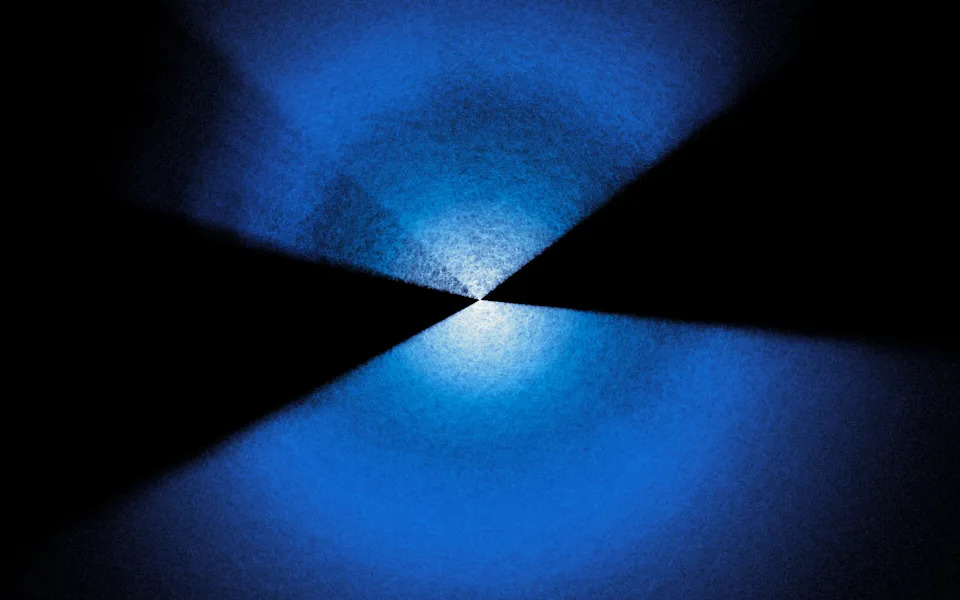 An hourglass shaped image of blue and white light on a black background