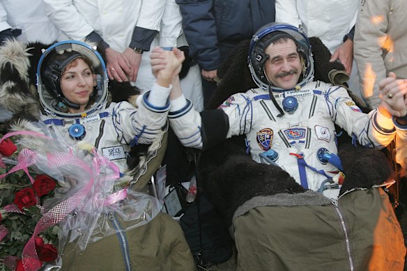 Ansari became the first female commercial space traveler, traveling alongside Russian cosmonaut Pavel Vinogradov (right) and American cosmonaut Jeffrey Williams.