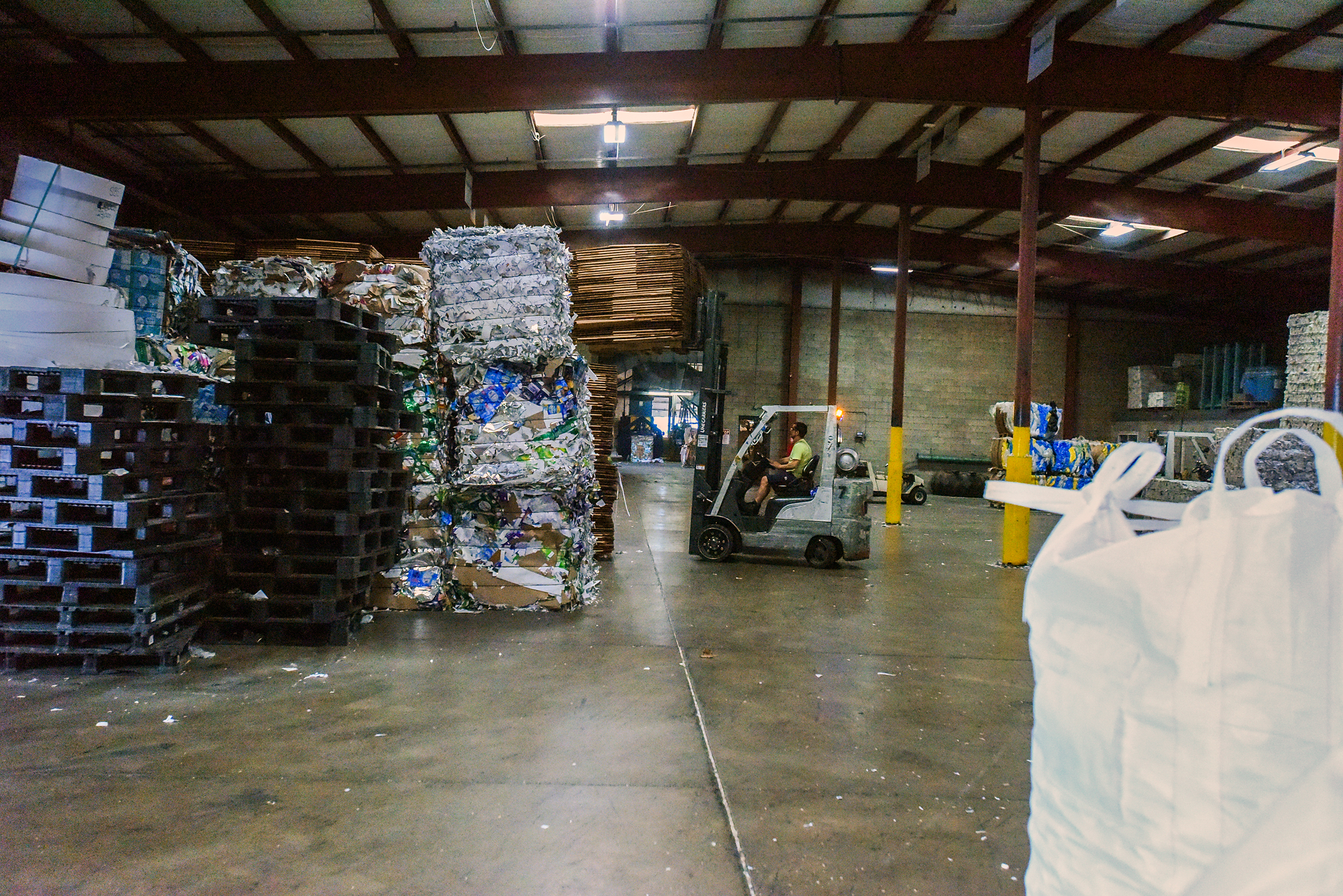 A forklift operator works in a warehouse on the premises.