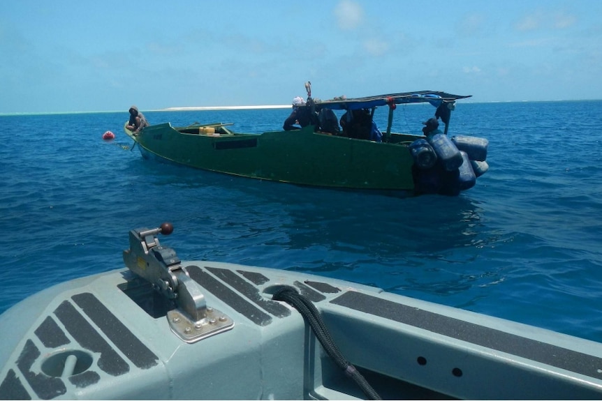 A small boat floating on the sea.