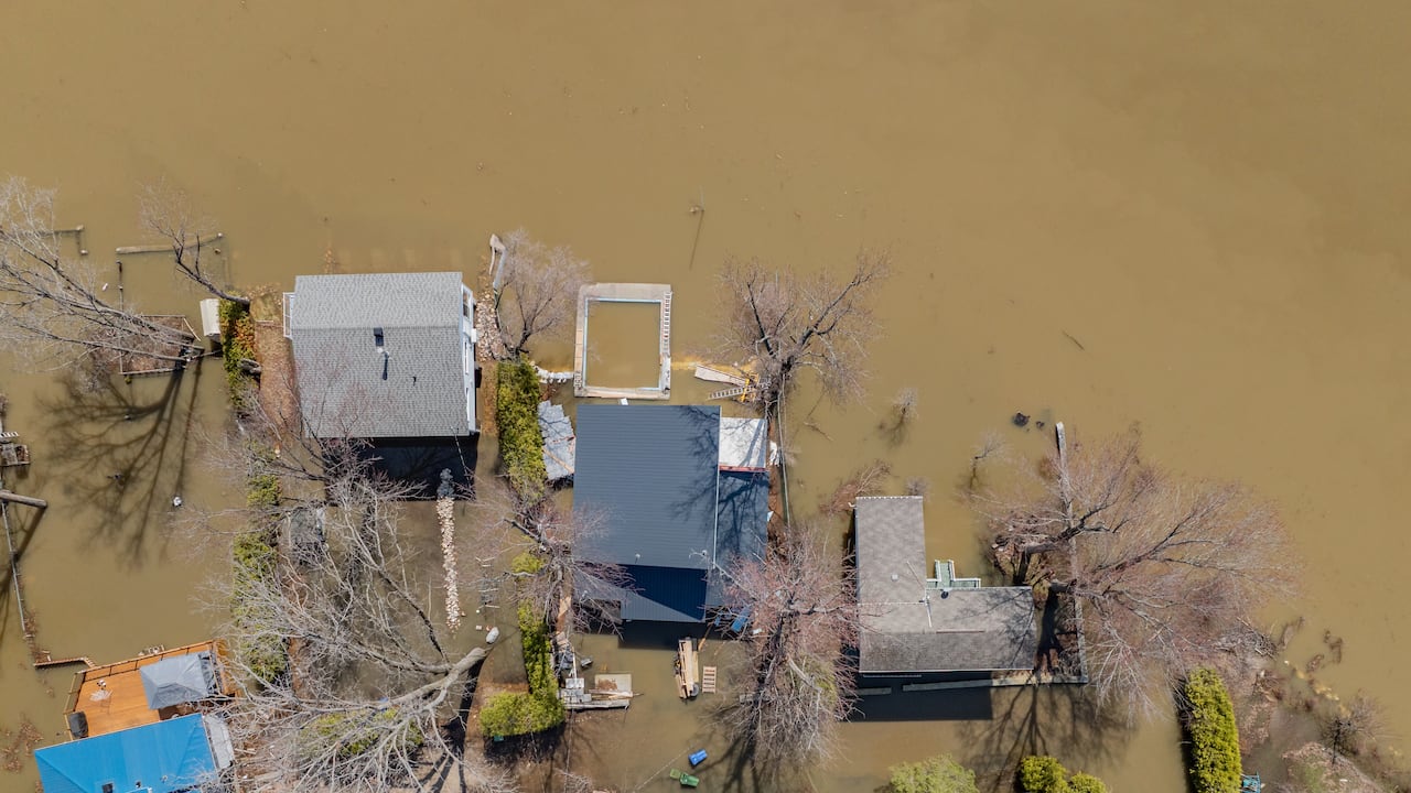 This drone photo taken Wednesday shows flooding in the Tourterelle Street area along the north bank of the Ottawa River, west of Gatineau, Que.