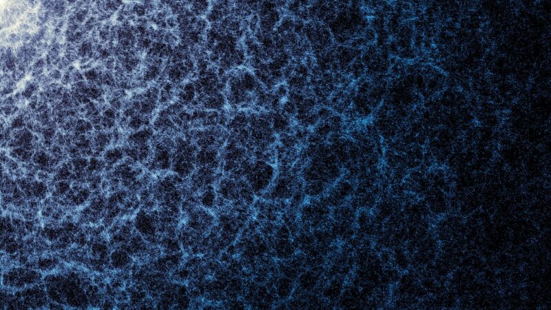 A 3D map of the universe: winding, wispy blue filaments connected irregularly to form a diffuse 3D web.