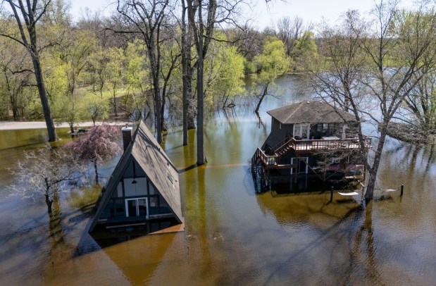 Rising Fox River waters flooded homes along Whippoorwill Drive in Crystal Lake on April 20, 2026. (Brian Cassella/Chicago Tribune)