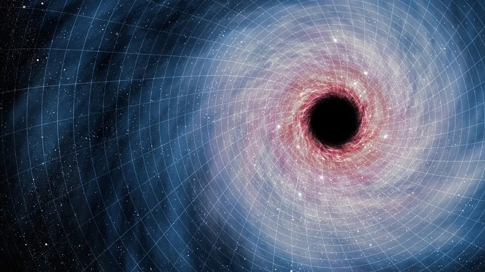 The swirl of blue and red light around the dark black hole on the right side of the image rests on a white grid of blocks that shows the structure of space-time.